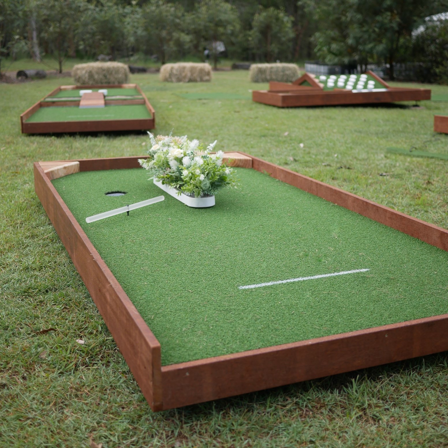 Wedding guests enjoying stylish mini golf