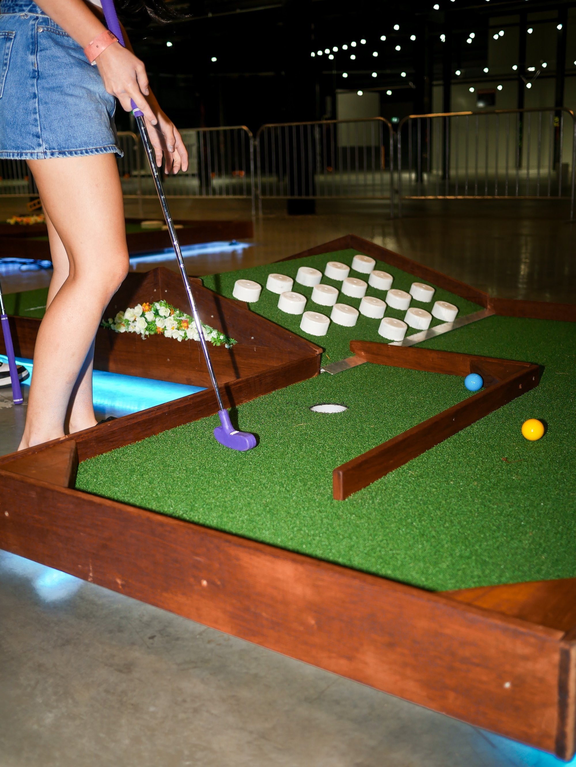 Guests playing mobile mini-golf during a corporate event in Brisbane