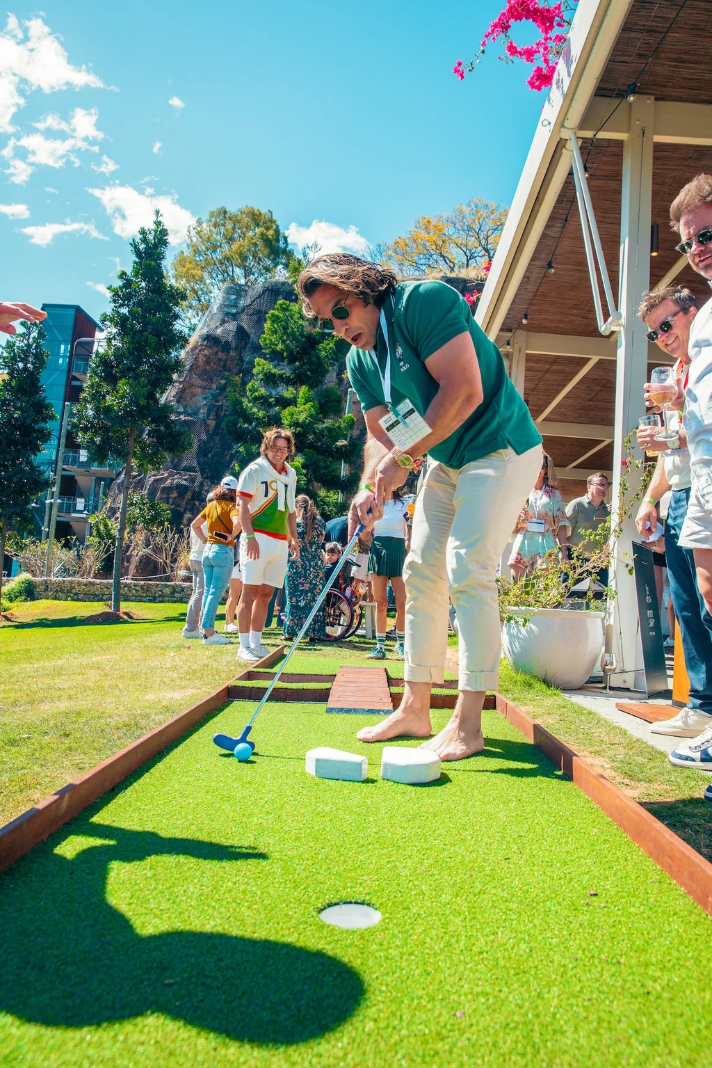 Professional putting at outdoor mini-golf course