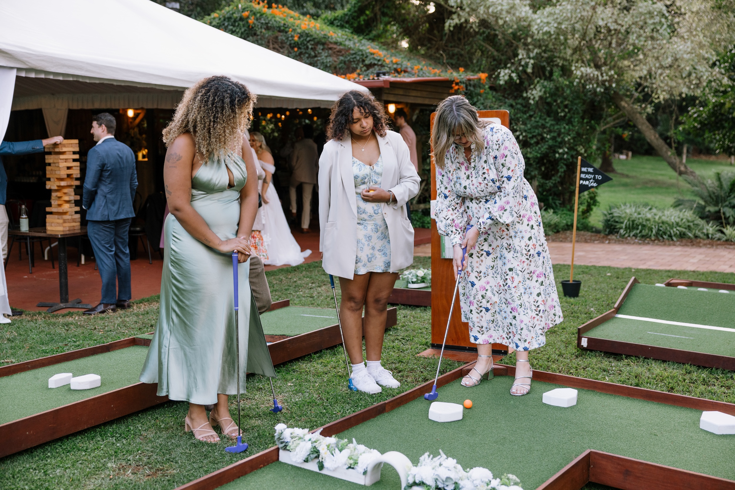 Bridesmaids playing mini-golf